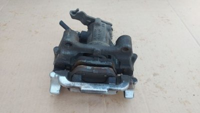 Суппорт задній лівий 5K0615423 VAG Фольксваген Гольф